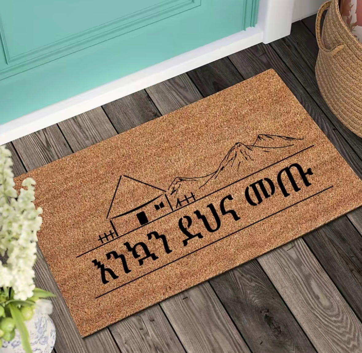 Make every entrance warm and inviting with our eco-friendly Coir Doormat a featuring beautifully designed Habesha art. Sized perfectly at 18”x 30” and 24"x36" , this durable and sustainable outdoor and indoor doormat adds a unique, cultural charm to your doorstep, creating a home-away-from-home feeling.Habesha Doormats, Ethiopian Welcome mat, Amaric, Tigregna and Oromifa Doormat